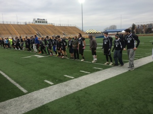 Members of the Alpha Tau Omega fraternity warm up before the annual charity football game at Dix Stadium on November 8.